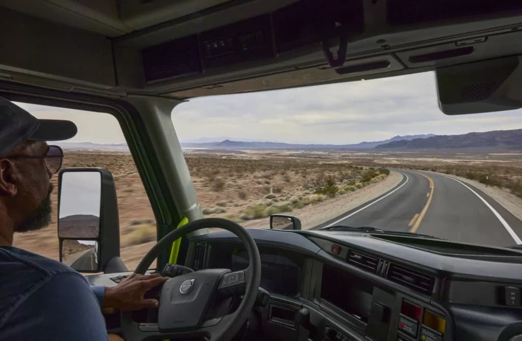 Truck driver driving in the desert