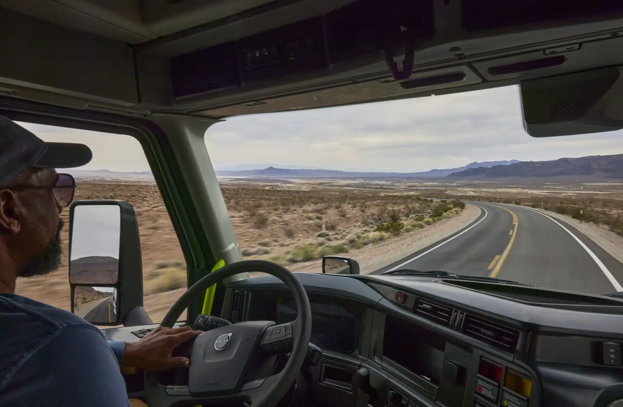 Truck driver driving in the desert